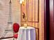 Unique dining room features a red chair, Eiffel Tower mural and gold decor at 10012 Voyager Way, Orlando, FL 32821