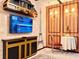 Dining room features unique decor, a tv, exposed brick and a modern hutch at 10012 Voyager Way, Orlando, FL 32821