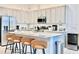 Bright kitchen features stainless steel appliances, gray cabinetry, and counter seating at 10012 Voyager Way, Orlando, FL 32821