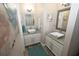 Well-lit bathroom featuring dual vanities with stone countertops and modern square sinks, creating a spa-like retreat at 1009 Troon Trce, Winter Springs, FL 32708