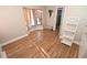 Bright bedroom with wood laminate flooring, bay window, decorative shelving, and neutral wall color at 1009 Troon Trce, Winter Springs, FL 32708