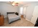 Bright bedroom with a ceiling fan and window that provides ample natural light at 1009 Troon Trce, Winter Springs, FL 32708