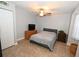 Light-filled bedroom featuring tile flooring, ceiling fan, neutral paint, a double closet and a large window at 1009 Troon Trce, Winter Springs, FL 32708