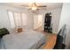 Bright bedroom featuring tile floors, neutral paint, ceiling fan, and views to an ensuite bathroom at 1009 Troon Trce, Winter Springs, FL 32708