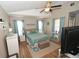 Serene bedroom with vaulted ceilings, ceiling fan, and calming blue accents create a peaceful retreat at 1009 Troon Trce, Winter Springs, FL 32708