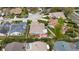 Aerial view of the property with its backyard featuring a deck, hot tub, landscaping, and privacy fence at 1071 Sweet Tree Ct, Apopka, FL 32712