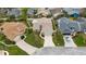 Aerial view of the property showcasing its location within a neighborhood with mature trees and landscaping at 1071 Sweet Tree Ct, Apopka, FL 32712