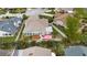 Aerial view of backyard with deck and hot tub plus surrounding fenced yard and landscaping at 1071 Sweet Tree Ct, Apopka, FL 32712