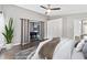 Well-lit bedroom with slider to game room, hardwood floors, and generous closet space at 1071 Sweet Tree Ct, Apopka, FL 32712