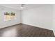 Neutral bedroom with large window and sleek wooden flooring at 1071 Sweet Tree Ct, Apopka, FL 32712