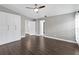This spacious bedroom features a ceiling fan, neutral paint, and lots of closet space at 1071 Sweet Tree Ct, Apopka, FL 32712