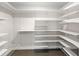 Spacious walk-in closet providing ample storage space with shelves and rods at 1071 Sweet Tree Ct, Apopka, FL 32712