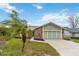 Charming home with a well-kept lawn, mature landscaping, and a two-car garage at 1071 Sweet Tree Ct, Apopka, FL 32712