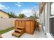 Backyard showcasing a wooden hot tub with stairs and bar, perfect for relaxation and entertainment at 1071 Sweet Tree Ct, Apopka, FL 32712