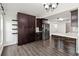 Spacious kitchen featuring wooden cabinets, stainless steel appliances, and an island with a white countertop at 1071 Sweet Tree Ct, Apopka, FL 32712