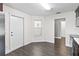 Bright kitchen area with an adjacent exit door and stainless appliances that provide a functional workspace at 1071 Sweet Tree Ct, Apopka, FL 32712