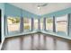 Sunroom featuring multiple windows that provide lots of natural light and beautiful views at 1071 Sweet Tree Ct, Apopka, FL 32712