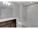 Clean bathroom with white vanity, toilet, and tiled shower and tub at 1117 Pavia Dr, Apopka, FL 32703