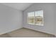 Bedroom featuring neutral carpet, a large window, and a sloped ceiling at 1117 Pavia Dr, Apopka, FL 32703