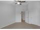 Neutral bedroom featuring carpet, ceiling fan, closet, and open doorway at 1117 Pavia Dr, Apopka, FL 32703