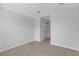 Bedroom with neutral carpet, walk-in closet, and open doorway at 1117 Pavia Dr, Apopka, FL 32703