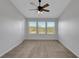 Spacious bedroom with multiple windows and neutral carpet and paint at 1117 Pavia Dr, Apopka, FL 32703