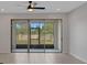 Bright room with sliding glass doors leading to lanai and outdoor space at 1117 Pavia Dr, Apopka, FL 32703