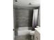 Bathroom showcasing tiled shower-tub with white toilet and vanity at 1324 S Pine Ridge Cir # D2, Sanford, FL 32773
