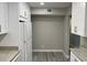 Bright kitchen featuring wood floors, granite countertops, and white cabinetry at 1324 S Pine Ridge Cir # D2, Sanford, FL 32773