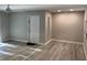 Living room with light wood-look floors and a front door to the left at 1324 S Pine Ridge Cir # D2, Sanford, FL 32773