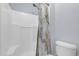 This bathroom features a tiled shower with a built-in seat and modern fixtures for a clean and stylish look at 137 Golfside Cir, Sanford, FL 32773