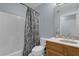 Cozy bathroom with shower-tub combo, neutral countertop, and a vanity with storage at 137 Golfside Cir, Sanford, FL 32773
