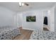 This bright bedroom features two beds and a TV at 137 Golfside Cir, Sanford, FL 32773