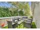 Outdoor patio area with stylish patio furniture set against lush green landscaping at 137 Golfside Cir, Sanford, FL 32773