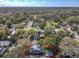 Birds eye view of the property showcasing its backyard, garage, and surrounding lush greenery at 16 N Lawsona Blvd, Orlando, FL 32801