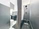 Modern black tiled bathroom showcasing the stylish sink, toilet and walk-in shower/tub at 16 N Lawsona Blvd, Orlando, FL 32801