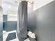 Bathroom with a black tiled shower and tub combination, and a unique vanity at 16 N Lawsona Blvd, Orlando, FL 32801