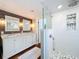 Bathroom with double vanity and a modern glass-enclosed shower with patterned tile at 16 N Lawsona Blvd, Orlando, FL 32801