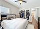 Bedroom with neutral walls, fluffy rug, and clothing rack and storage at 16 N Lawsona Blvd, Orlando, FL 32801