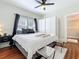Bedroom with a ceiling fan and a closet, offering comfort and functionality at 16 N Lawsona Blvd, Orlando, FL 32801