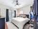 Cozy bedroom featuring natural light from the windows and a plush rug over hardwood floors at 16 N Lawsona Blvd, Orlando, FL 32801