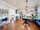 Open dining area with hardwood floors, modern lighting, and a seamless connection to the kitchen at 16 N Lawsona Blvd, Orlando, FL 32801