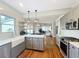 Kitchen with stainless appliances, open shelving, and an island with a sink offers an open layout at 16 N Lawsona Blvd, Orlando, FL 32801