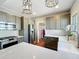 Modern kitchen with stainless steel appliances, custom cabinets, and light countertops at 16 N Lawsona Blvd, Orlando, FL 32801