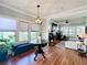 Cozy living room features wood floors, lots of natural light, and views into another seating area at 16 N Lawsona Blvd, Orlando, FL 32801