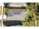 Aerial view of the home's roof, lawn, landscaping and perimeter of property at 17216 Goldcrest Loop, Clermont, FL 34714