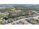 Aerial view of homes surrounded by scenic lakes and tree-lined landscapes at 17216 Goldcrest Loop, Clermont, FL 34714