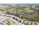 Aerial view of homes surrounded by serene ponds and tree-lined landscapes at 17216 Goldcrest Loop, Clermont, FL 34714