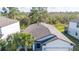 Aerial view of home showing roof, landscaping and proximity to nature preserve at 17216 Goldcrest Loop, Clermont, FL 34714