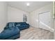 Versatile bonus room with tile floors, a sectional sofa, and a closet at 17216 Goldcrest Loop, Clermont, FL 34714